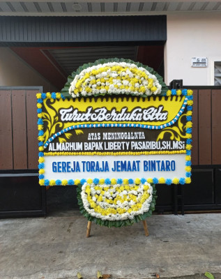 Papan Bunga Duka di Tauno